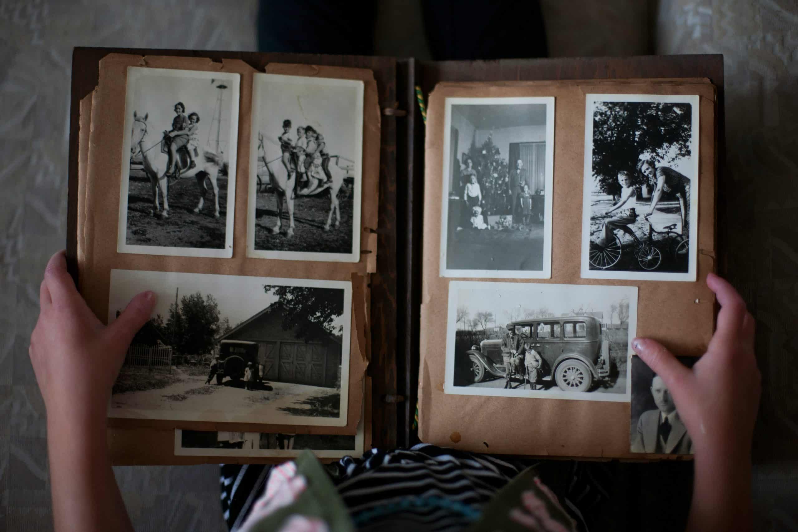 A child looking at old family photographs